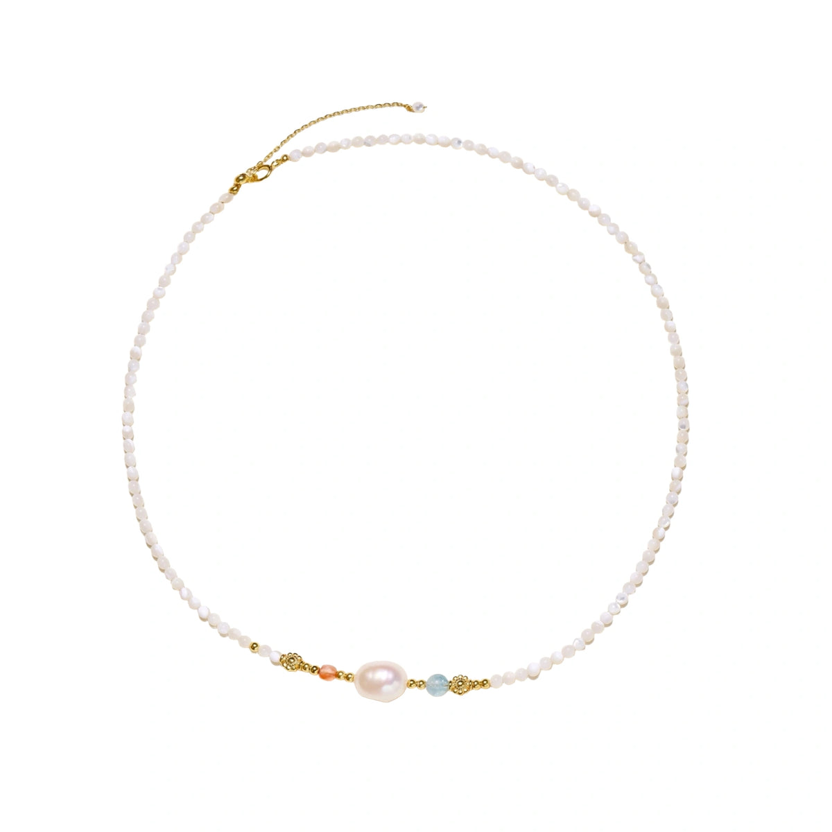 Delicate white beaded necklace with baroque pearl center, gold accents, and coral and aqua gemstones on cream background.