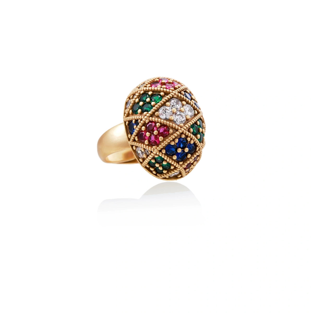 Oversized gold ring with geometric mosaic pattern featuring multicolor zirconia stones in ruby, emerald, sapphire, and clear tones.