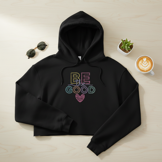 Schwarzer gekürzter hoodie aus bio-baumwolle mit buntem neon-be the good print und gestreiftem herz für frauen