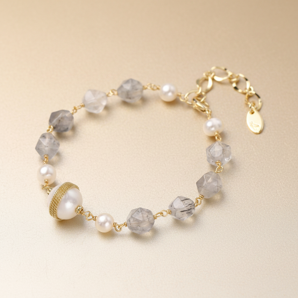 Baroque pearl and quartz bracelet, 14K gold-plated Eco-brass by flyliving, featuring faceted grey quartz, freshwater pearls, and a central mesh-wrapped large pearl.