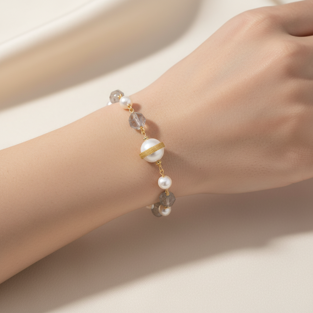 14K gold-plated eco-brass bracelet with baroque freshwater pearls and quartz by flyliving, featuring a central pearl with a gold band, worn on a wrist.
