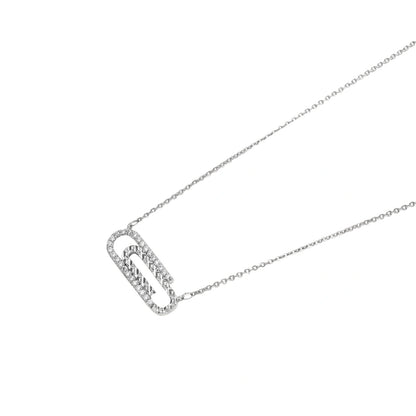 White gold plated necklace with dual-frame geometric pendant featuring crystal pavé border on pale background.