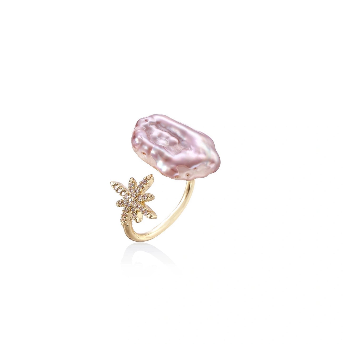 Eine zarte goldring mit großer unregelmäßiger rosa perle und sternenklare diamantbesetztem sternmuster