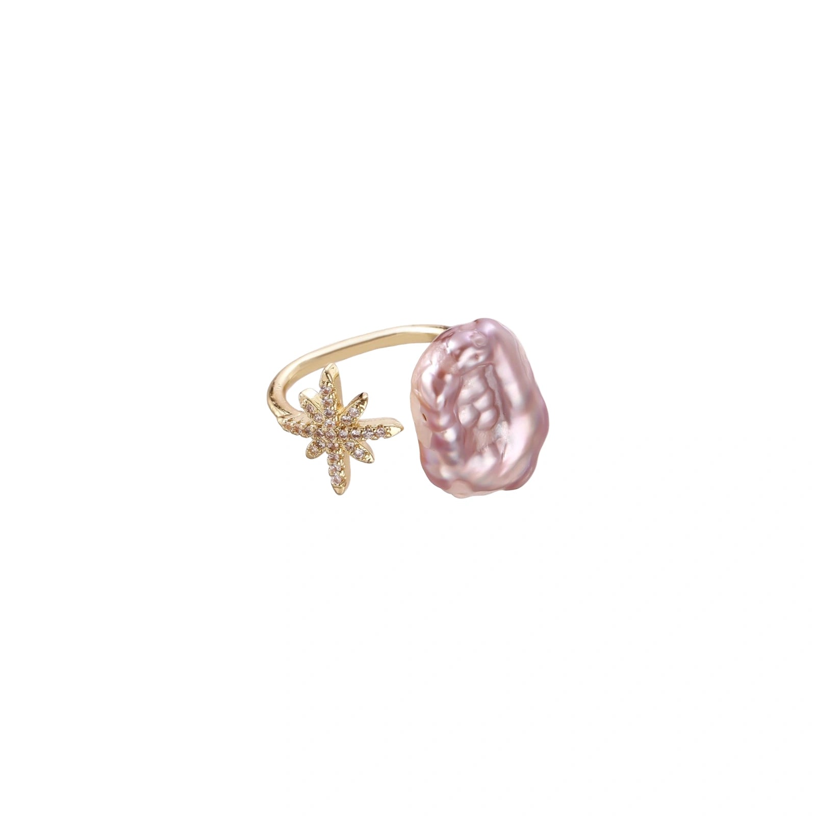 Adjustable gold ring with pink baroque freshwater pearl and crystal-studded star charm on white background