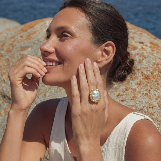 14K gold-plated Baroque pearl crown ring by flyliving with textured gold detailing, worn by a smiling woman.