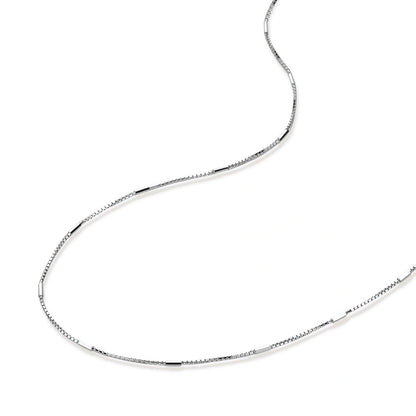 Delicate platinum-plated sterling silver necklace with alternating textured cubic links and smooth chain sections.