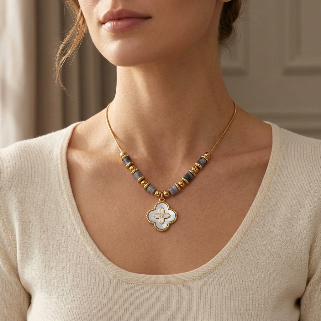 18K gold-plated cloverleaf necklace by flyliving with an Abalone pendant and gray beaded accents on a thin chain.