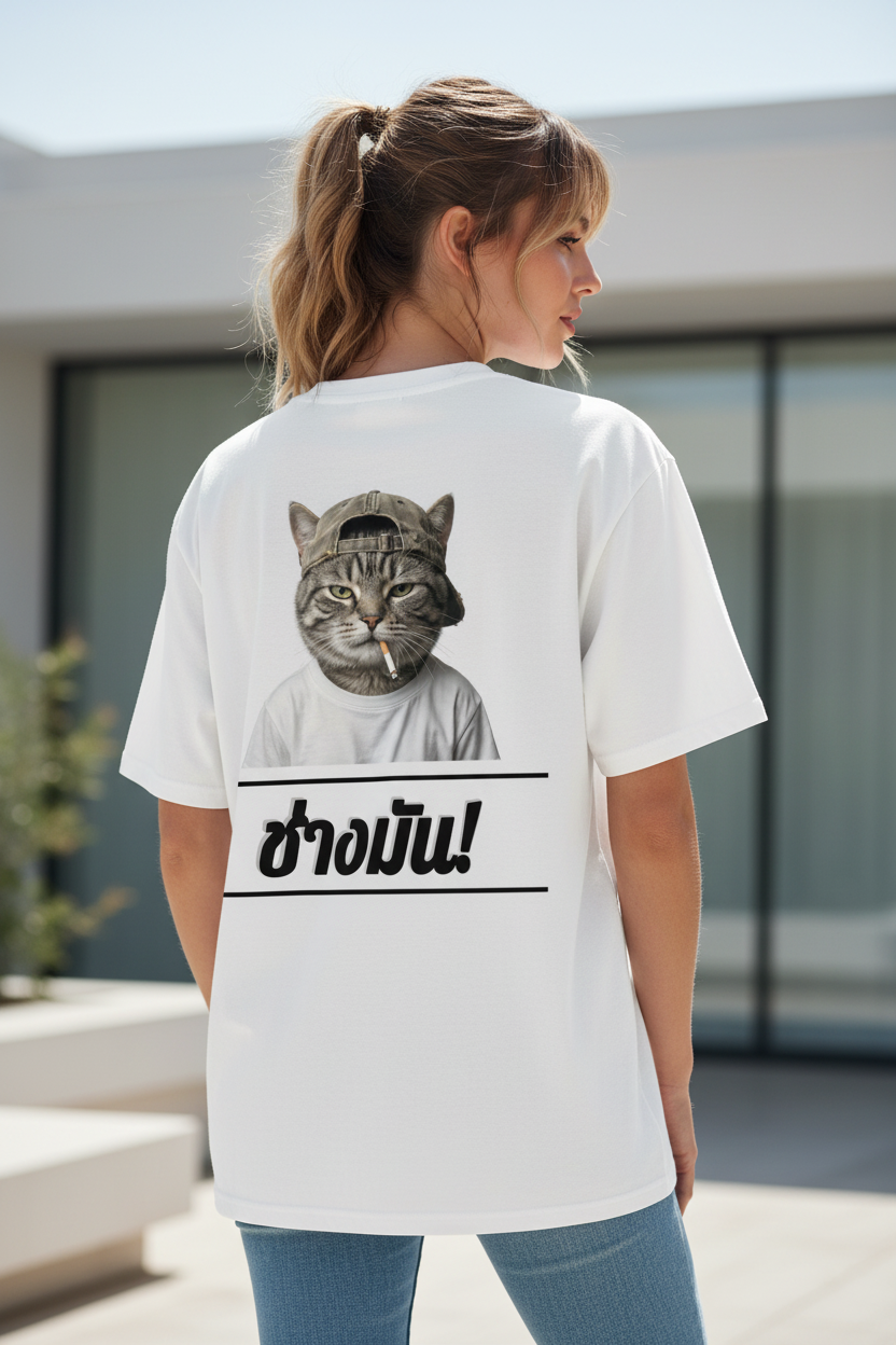 White oversized T-shirt by flyliving with a 'Cool Cat' graphic smoking, and Thai text 'ช่างมัน!' on the back.