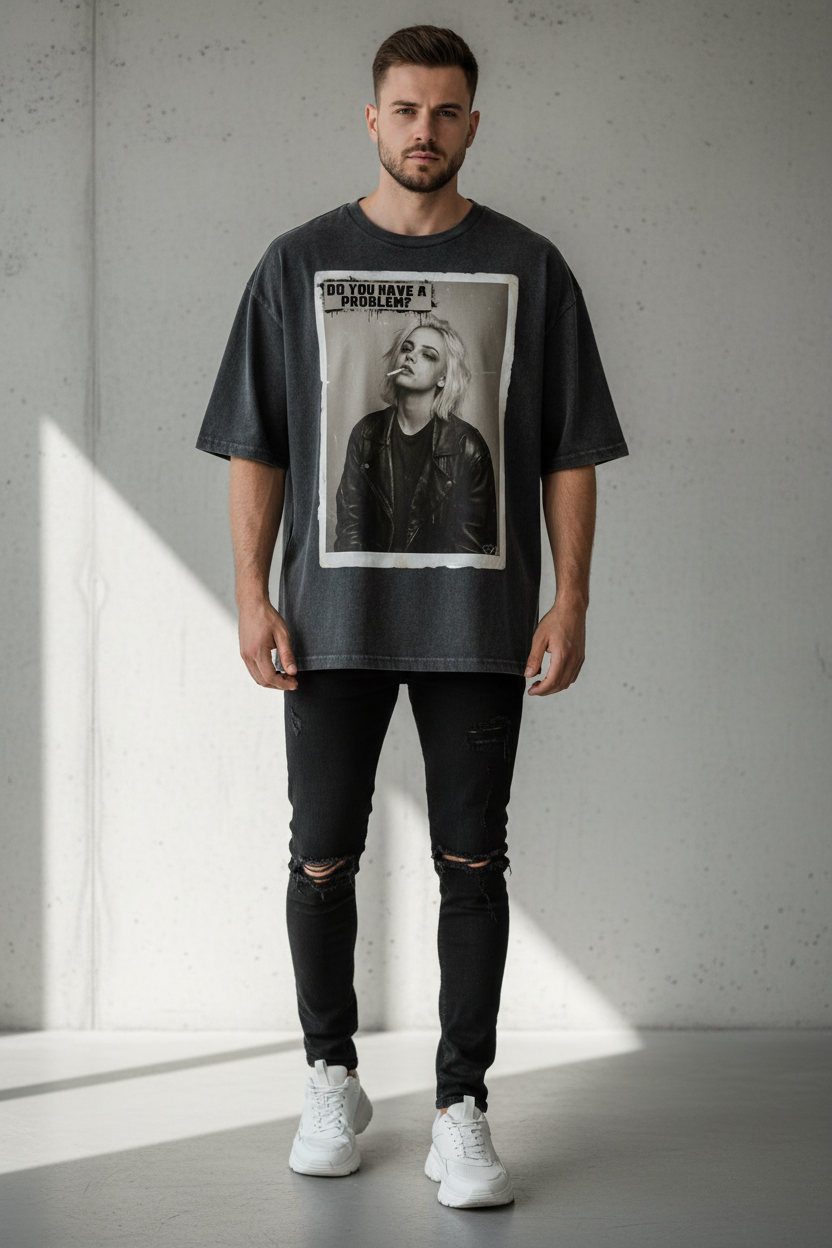 Oversized charcoal t-shirt by flyliving, featuring a graphic print of a smoking woman and 'DO YOU HAVE A PROBLEM?' text, worn with ripped black jeans.