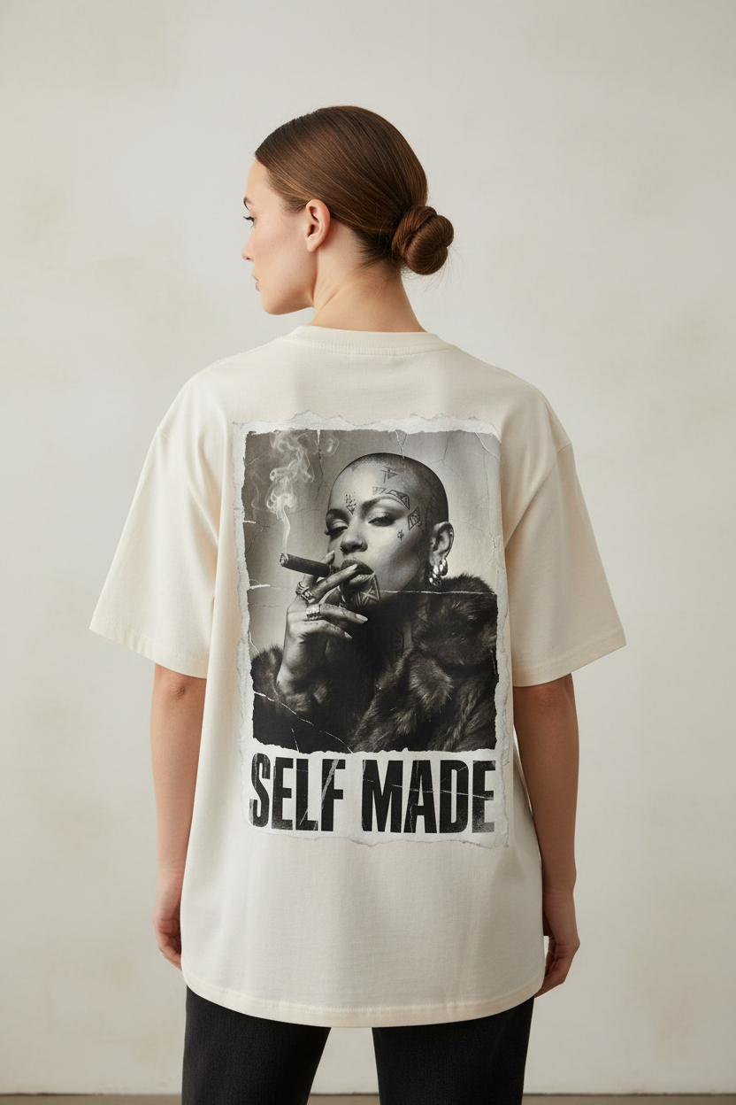 Oversized cream T-shirt by flyliving with a distressed back print of a woman smoking a cigar and 'SELF MADE' text.