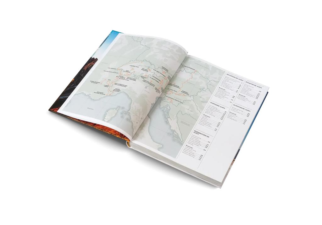 Das Buch Wanderlust Alpen von gestalten EU Shop ist aufgeschlagen vor weißem Hintergrund abgebildet. Auf der linken Seite befinden sich detaillierte Kartenrouten und beschriftete Städte, auf der rechten Seite eine Tabelle mit Text und Zahlen.