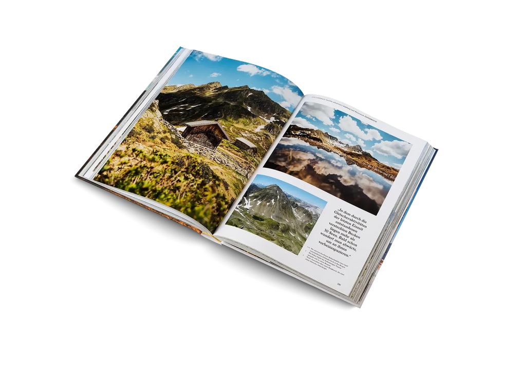 Das aufgeschlagene Buch Wanderlust Alpen von gestalten EU Shop zeigt lebendige Berg-, Hütten- und Seefotos unter blauem Himmel - die perfekte Inspiration für Ihr nächstes Alpenabenteuer. Auf dem weißen Hintergrund ist ein Textblock zu sehen.