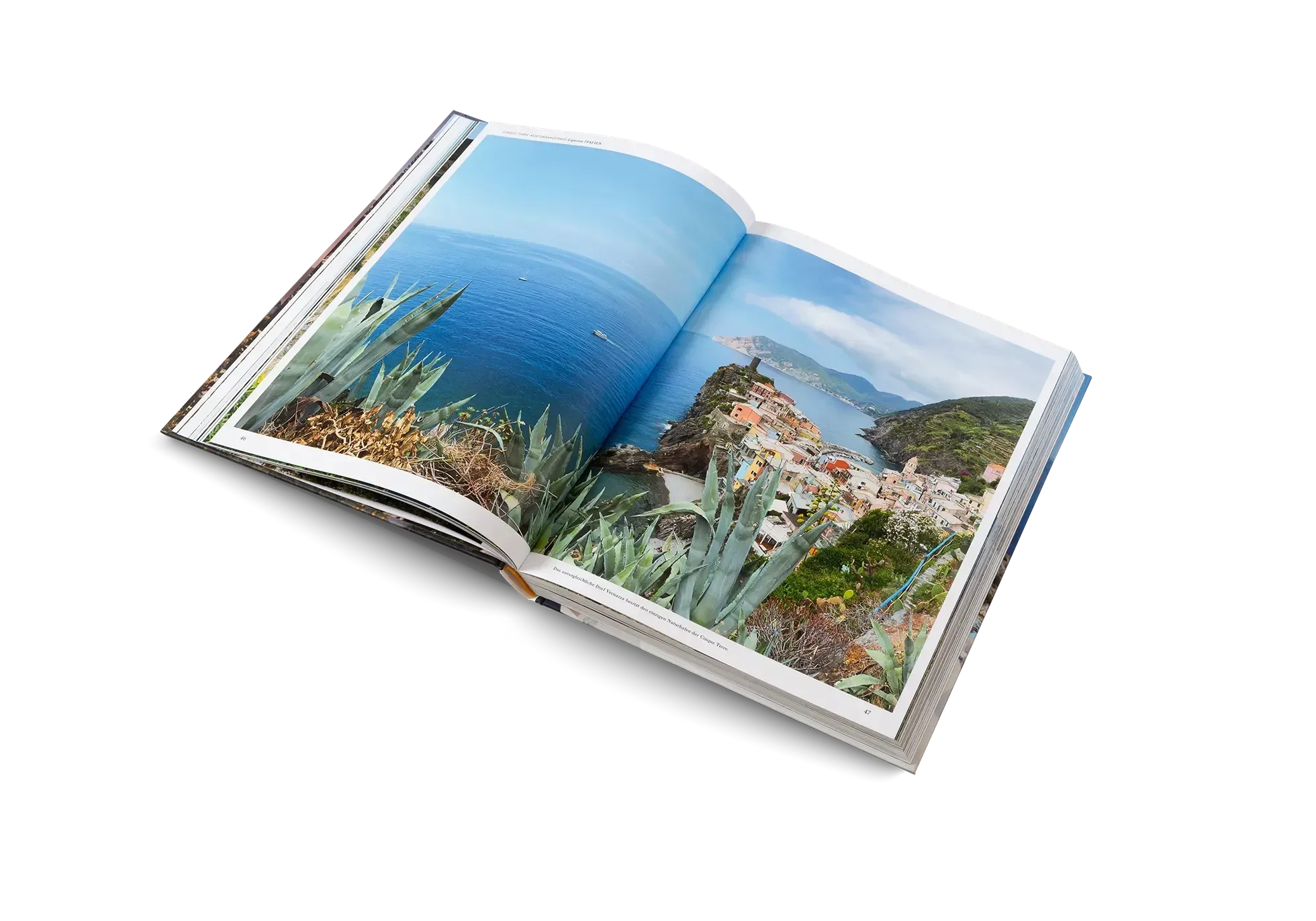 Ein aufgeschlagenes Buch von gestalten EU Shop's Wanderlust Mittelmeer zeigt ein atemberaubendes Foto einer mediterranen Stadt - blaues Meer, grüne Hügel und Agaven - perfekt für Fans von mediterranen Wanderwegen und Tourentipps.