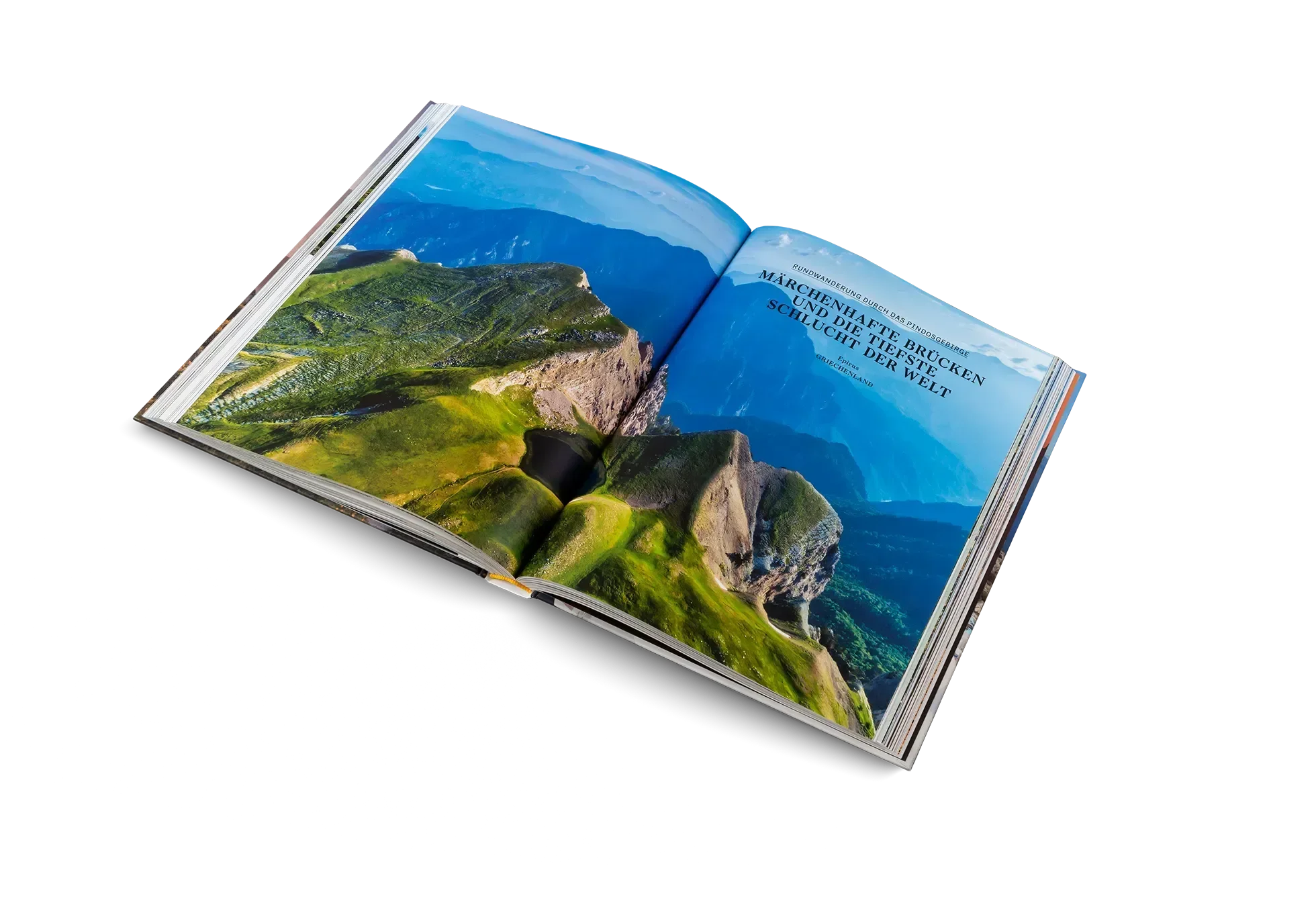 Das Buch "Wanderlust Mittelmeer" von gestalten EU Shop ist auf einem weißen Hintergrund aufgeschlagen und zeigt auf der rechten Seite ein Luftbild mit grünen Bergen unter blauem Himmel und deutschen Tourentipps.