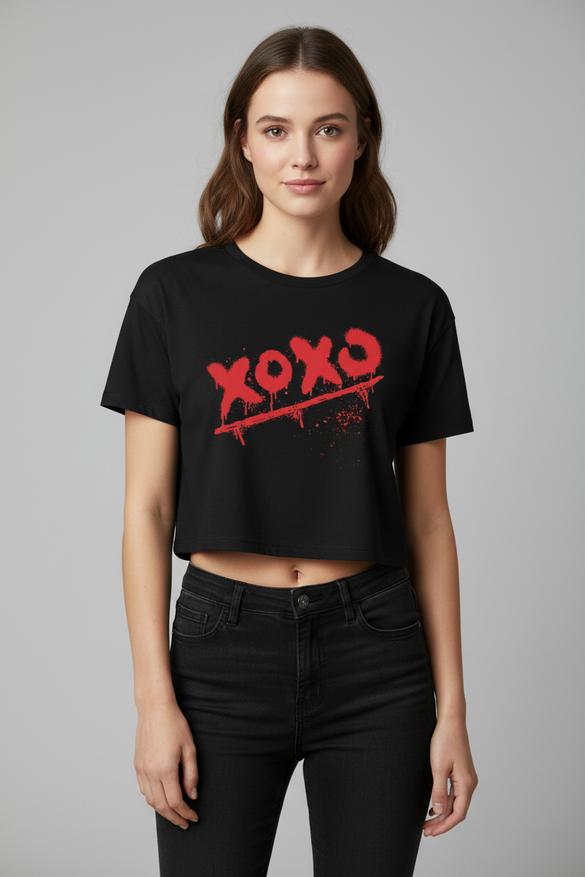 Black combed cotton relaxed fit crop top by flyliving, featuring a red spray-painted 'XOXO' graphic with drips and splatters.