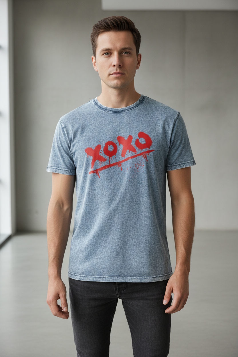 Blue stonewashed denim-style crewneck T-shirt by flyliving with a red 'xoxo' graffiti graphic, worn by a man.