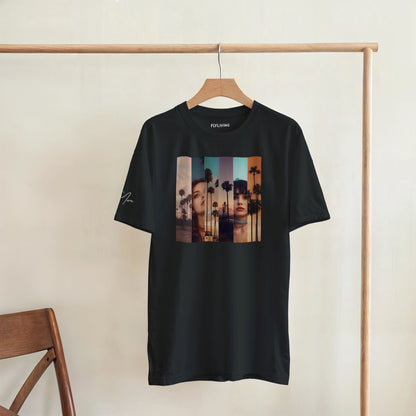 Schwarzes la sentimental heavyweight t-shirt mit kurzärmeliger schwerer baumwolle und farbigem collage-print zweier frauen vor palmen
