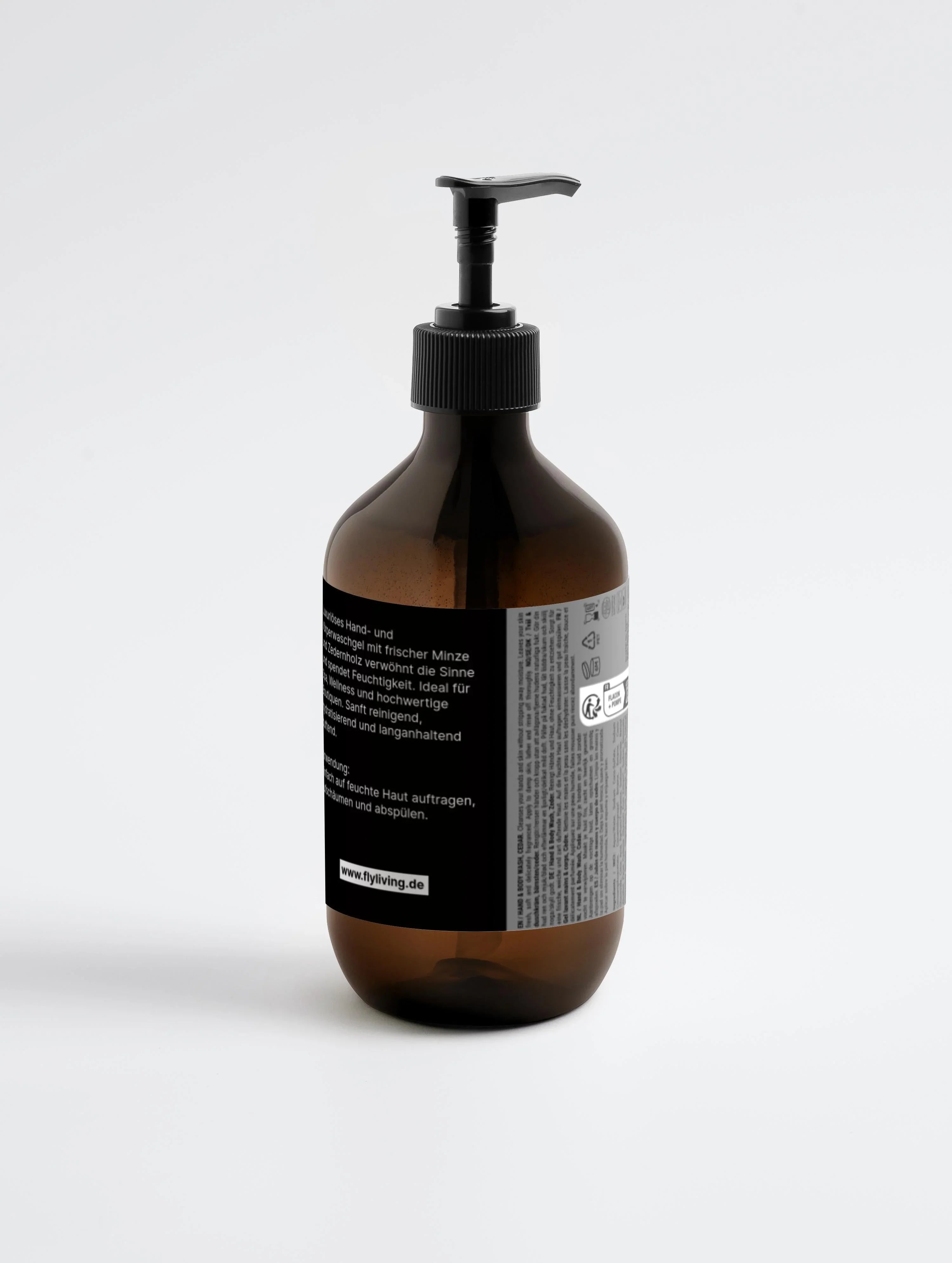 Hand- und Körperwaschgel mit Pfefferminz und Zedernholz von flyliving, in braunem Spender mit schwarzer Pumpe.
