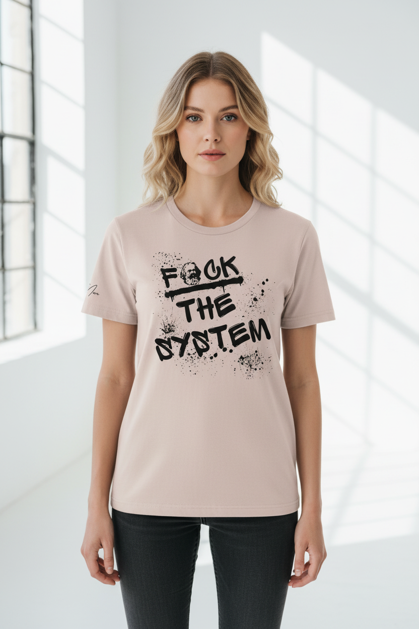 Unisex light pink T-shirt with a "F*CK THE SYSTEM" graffiti design by flyliving, worn by a woman with dark jeans, front view.
