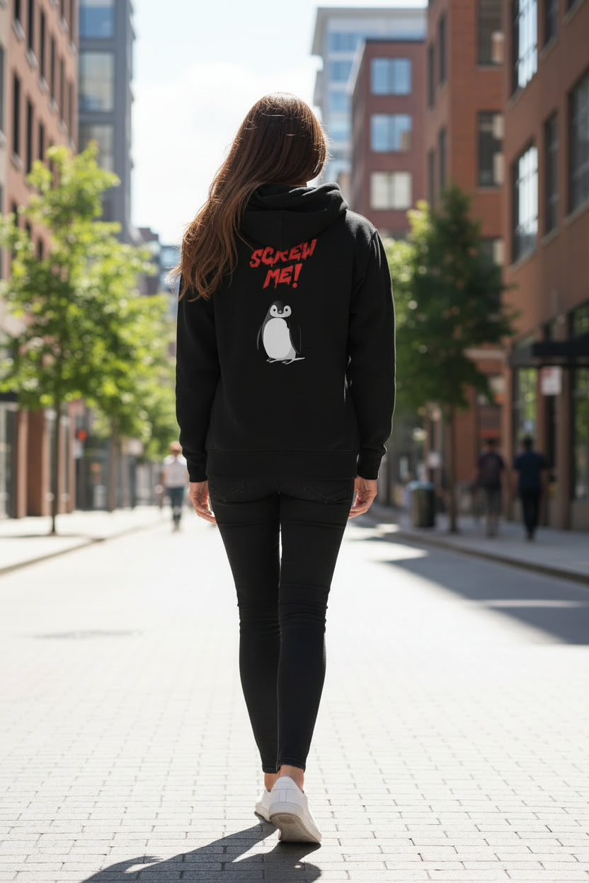 Black unisex hoodie by flyliving with a 'Screw Me' penguin graphic on the back, worn by a person walking away.
