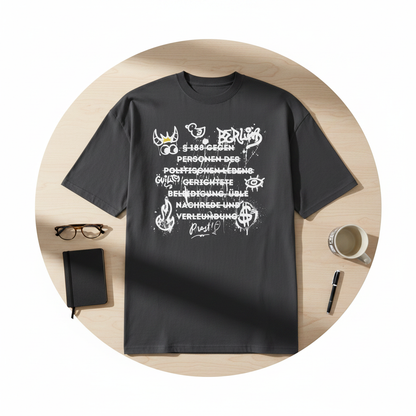 Dunkelgraues oversized kurzarmshirt mit weißem graffiti-stil grafikprint und text aus kunst statement ein bisschen chaos serie