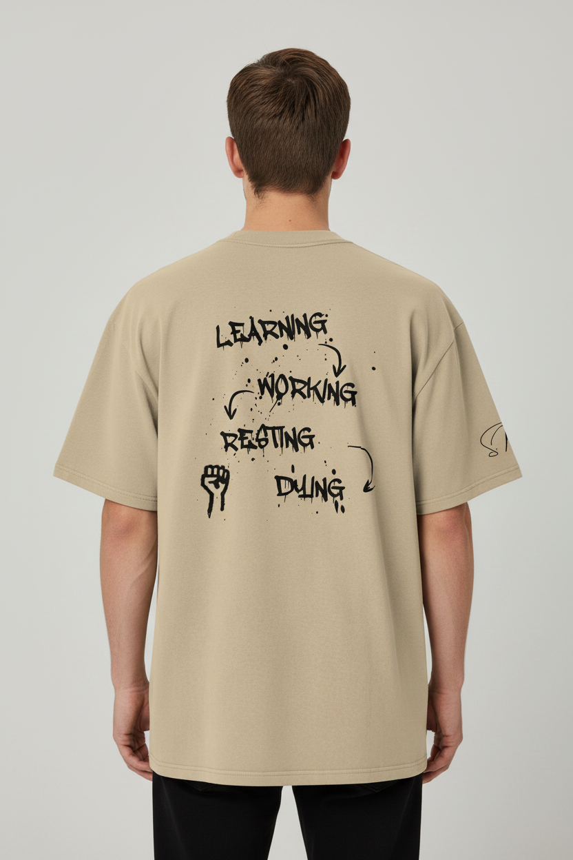 Beige heavy cotton oversized T-shirt by flyliving with a back black graphic depicting 'LEARNING, WORKING, RESTING, DYING' cycle and a raised fist.