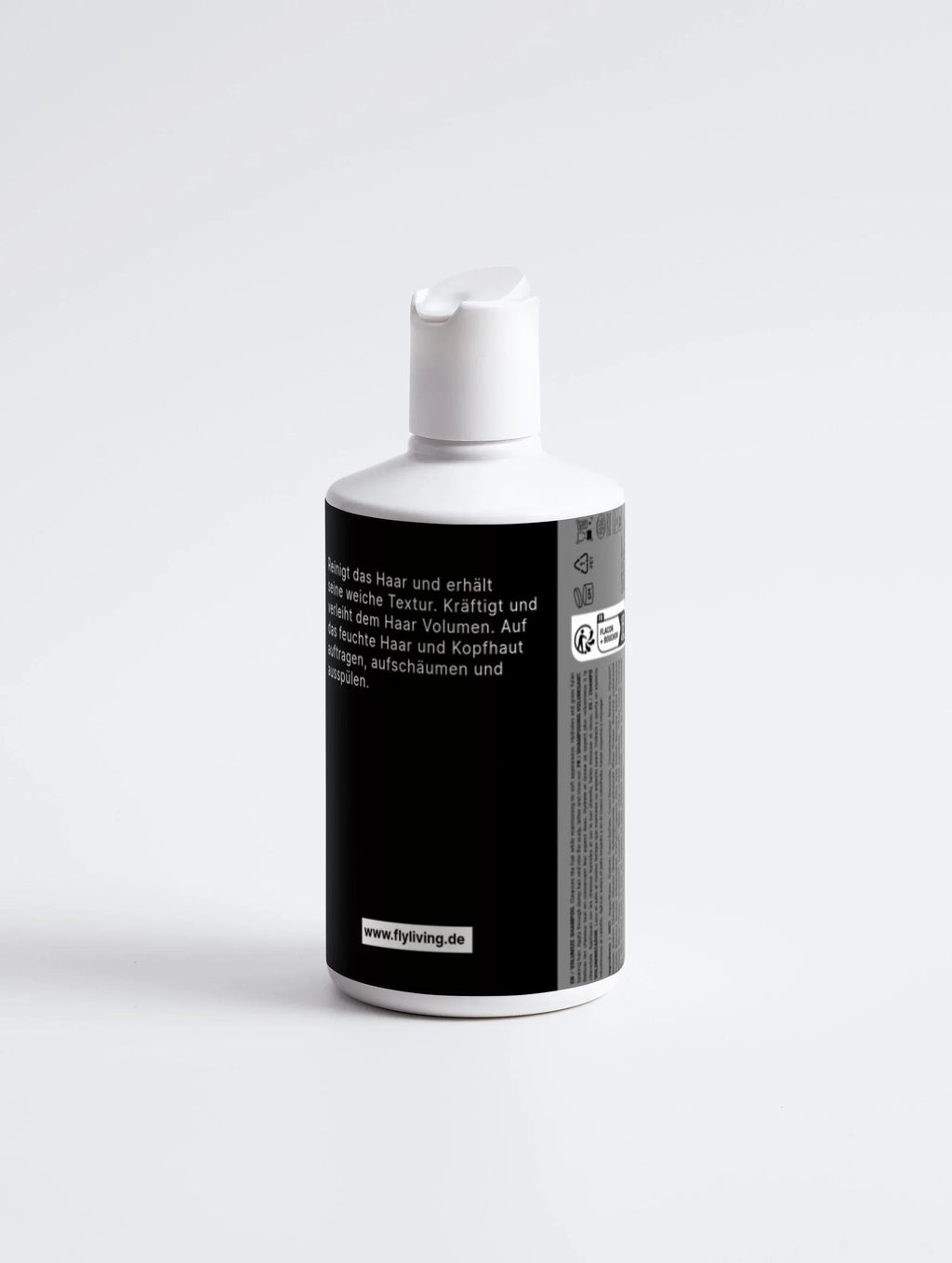 Pflege- und Volumen-Shampoo von flyliving, in einer weißen Flasche mit schwarzer Beschriftung.