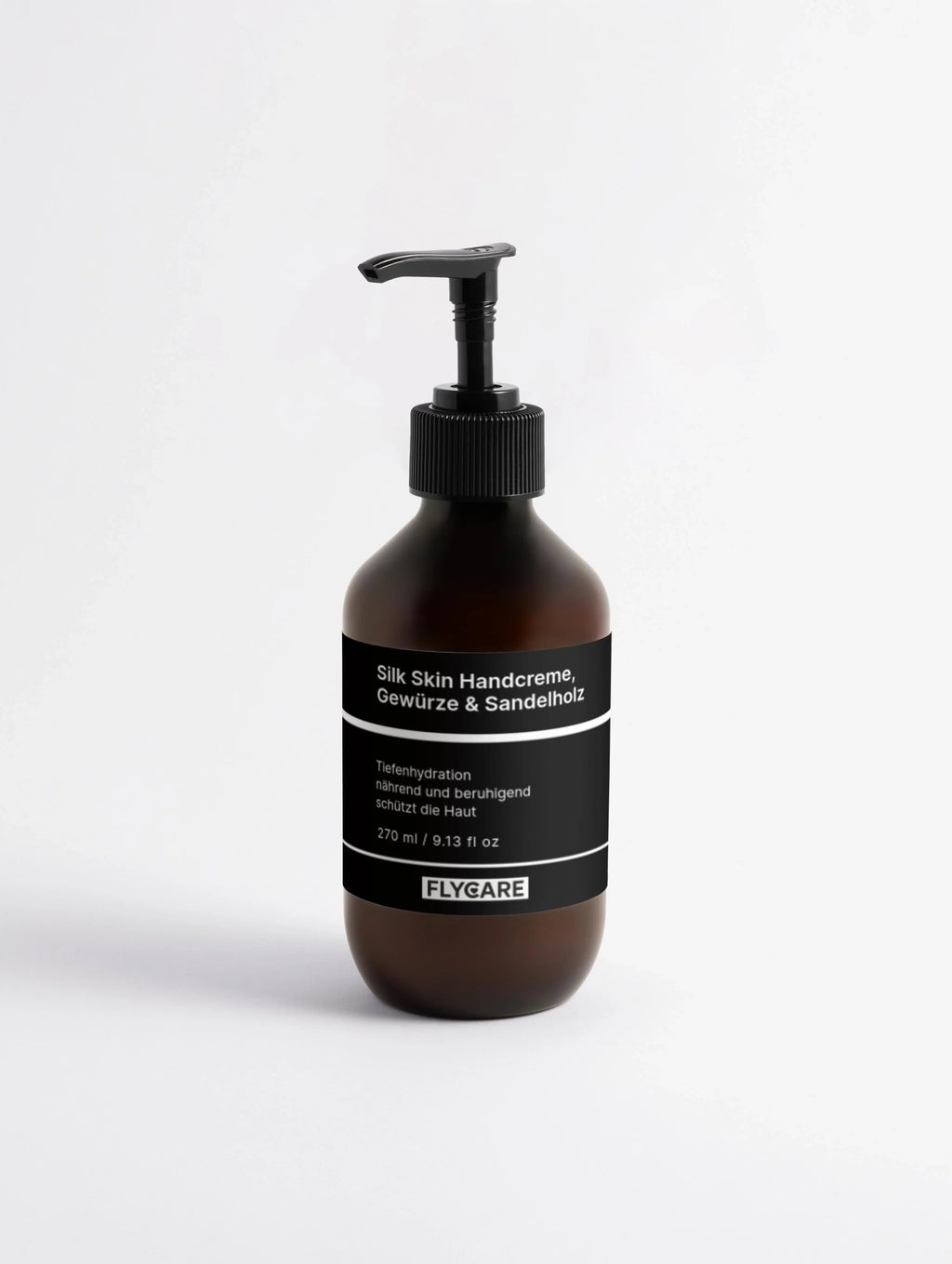 Braune Handcreme mit Sandelholz von Flycare, in einer braunen Glasflasche mit schwarzem Spender.