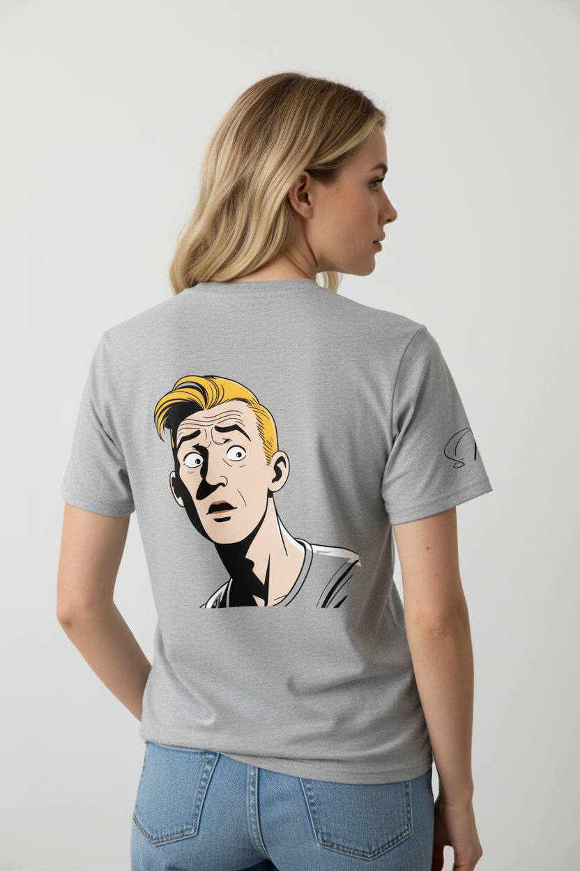 Grey unisex t-shirt by flyliving with a retro comic graphic print of a surprised blonde man on the back and a small black swirl on the sleeve, worn by a woman.