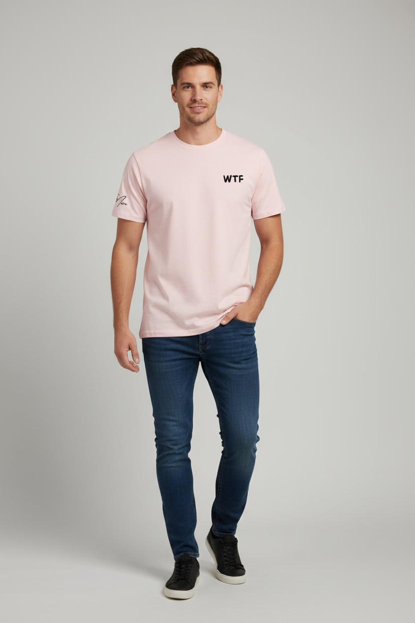 Pink Unisex T-Shirt by flyliving with 'WTF' graphic and sleeve signature, worn by a man in blue jeans.