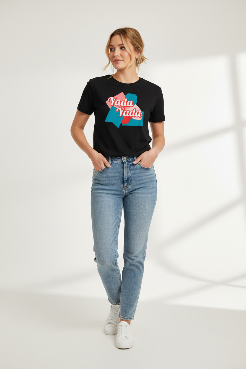 Black t-shirt by flyliving featuring 'Yada Yada' text on abstract teal and red shapes, worn with light blue jeans.