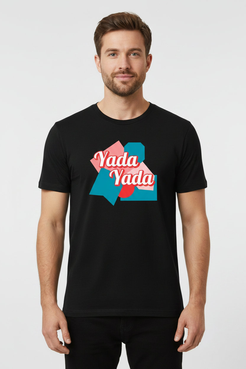 Black unisex T-Shirt by flyliving, featuring a "Yada Yada" graphic with pink, blue, and red geometric shapes, worn by a male model.