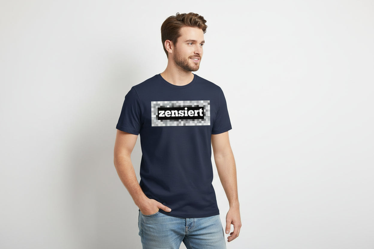 Dark blue cotton T-shirt by flyliving with "zensiert" text on a black bar over a pixelated gray field, worn by a male model.