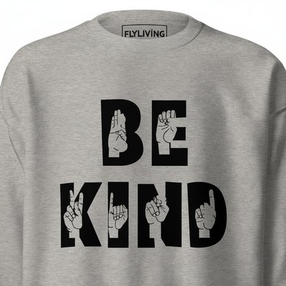 Grauer unisex pullover hochwertiger sweatshirt mit mutigem schwarzen be kind schriftzug und handzeichen in den buchstaben